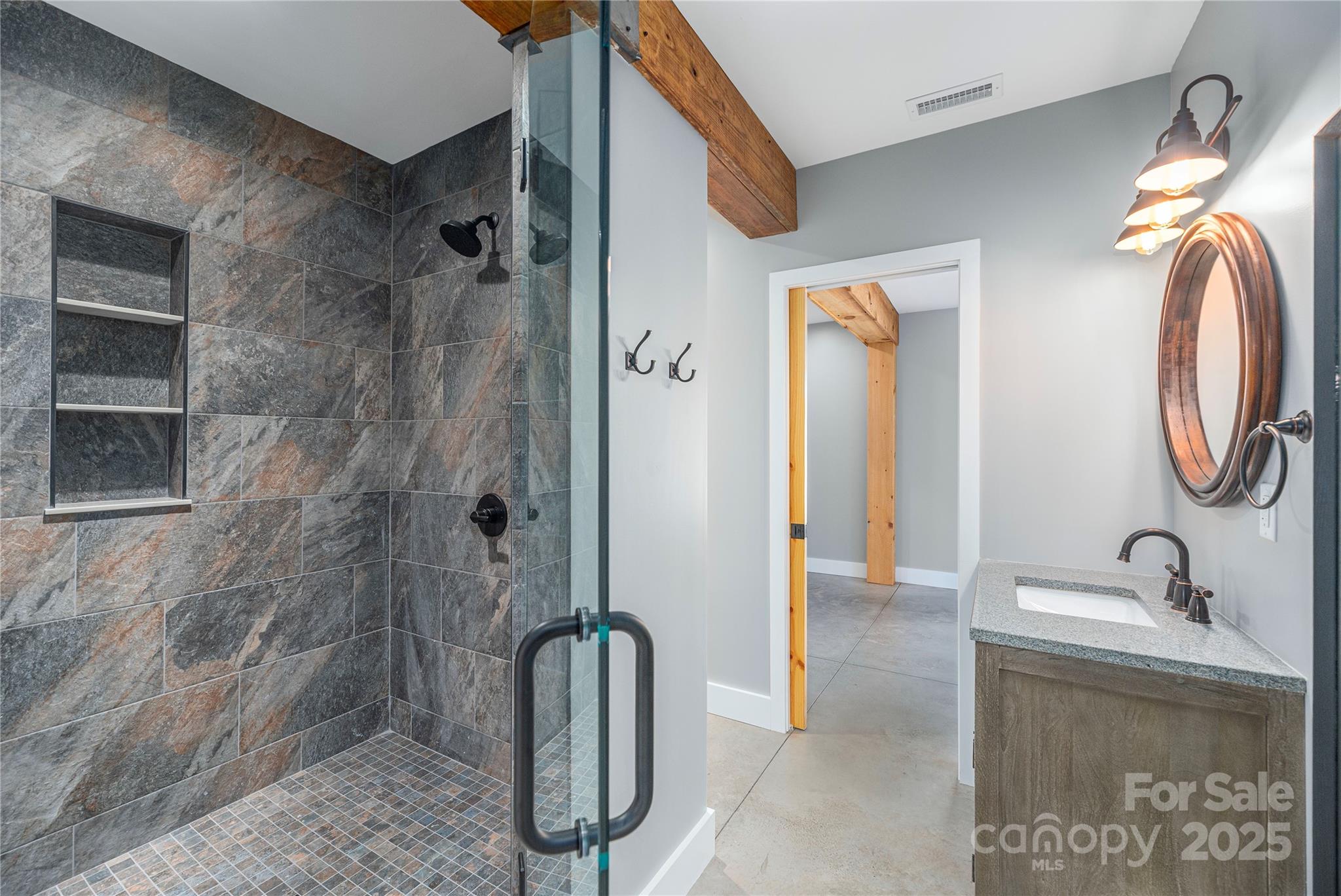 234 Erwin Hills Road Asheville, NC 28806 - Photo 38 of 47 a bathroom with a granite countertop sink a mirror and shower