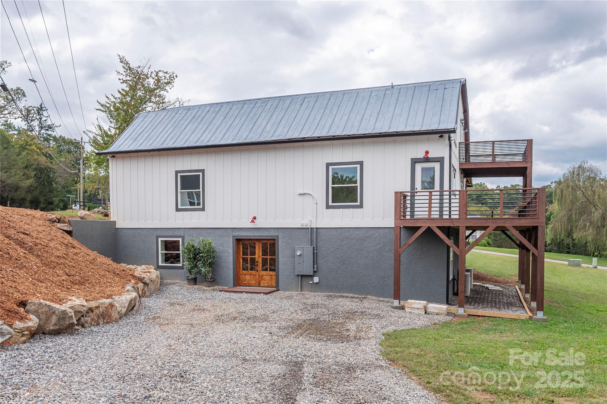 234 Erwin Hills Road Asheville, NC 28806 - Photo 45 of 47 a view of a house with backyard patio and entertaining space