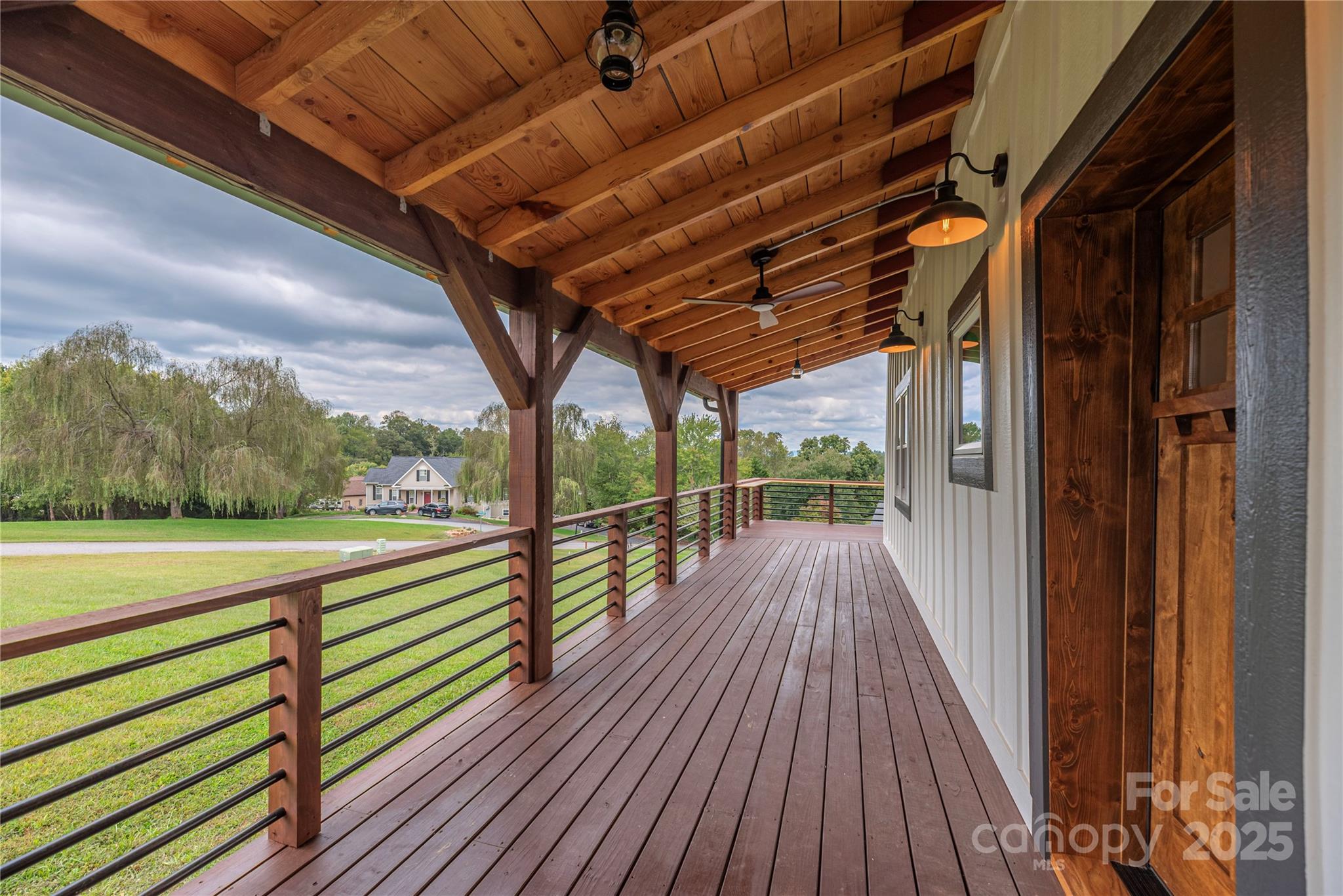 234 Erwin Hills Road Asheville, NC 28806 - Photo 6 of 47 a view of a balcony with wooden floor