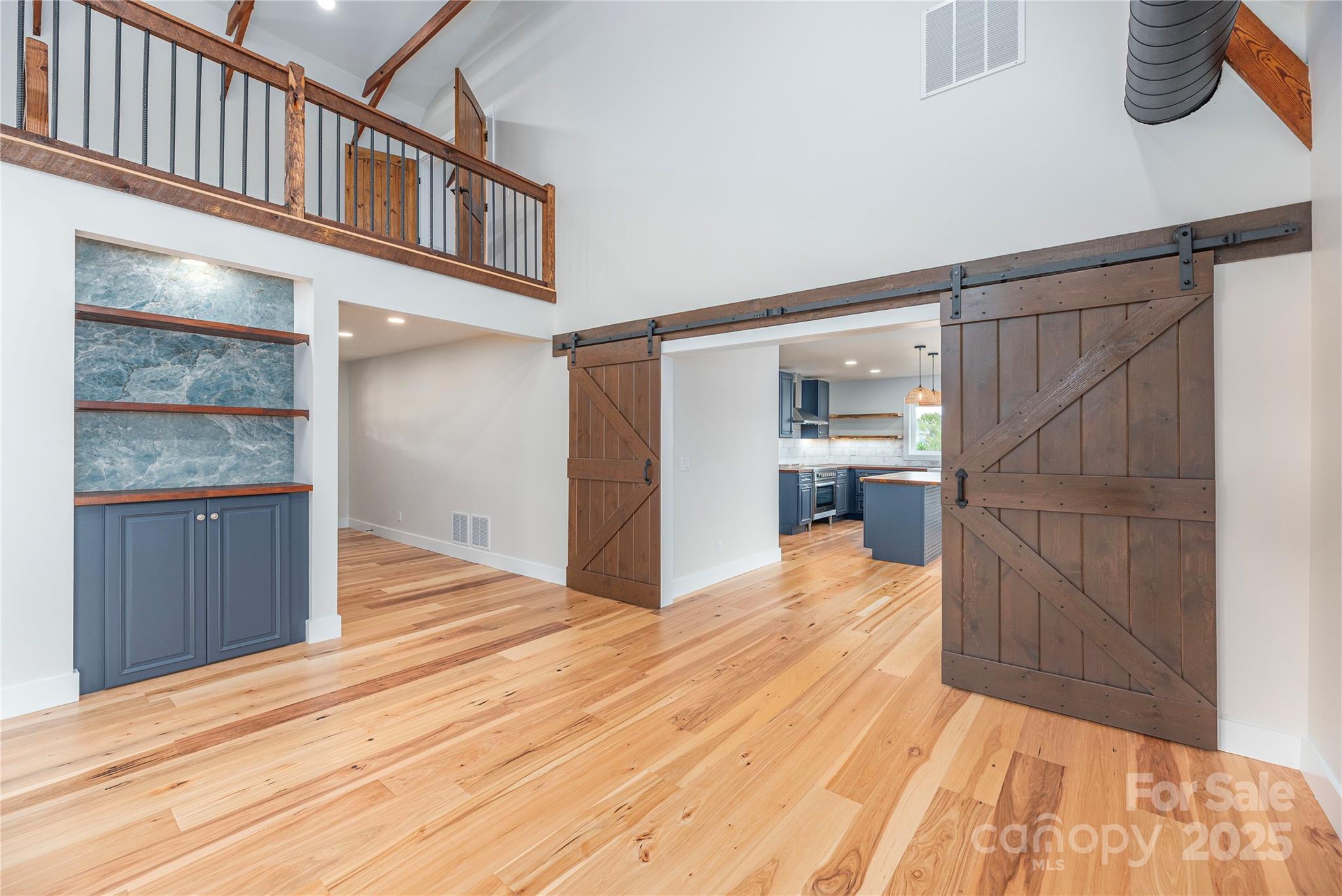 234 Erwin Hills Road Asheville, NC 28806 - Photo 9 of 47 a view of hallway with wooden floor and kitchen view