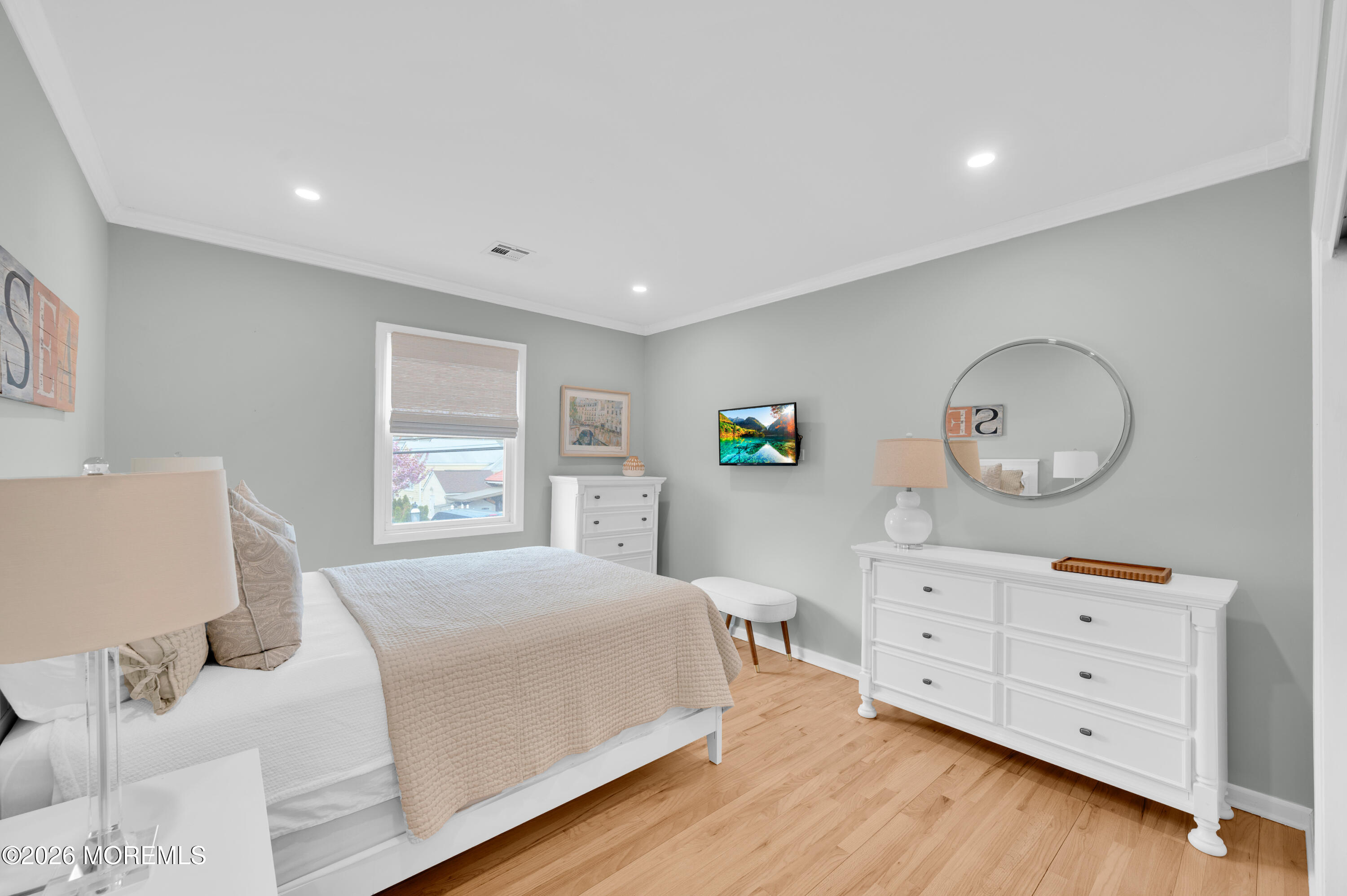 41 A Mount Street Bay Head, NJ 08742 - Photo 17 of 33 a bedroom with a bed and a dresser