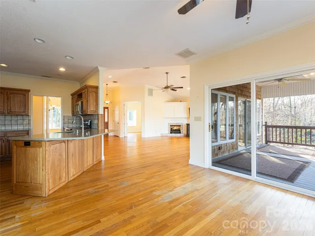 a living room with furniture a table and a large window