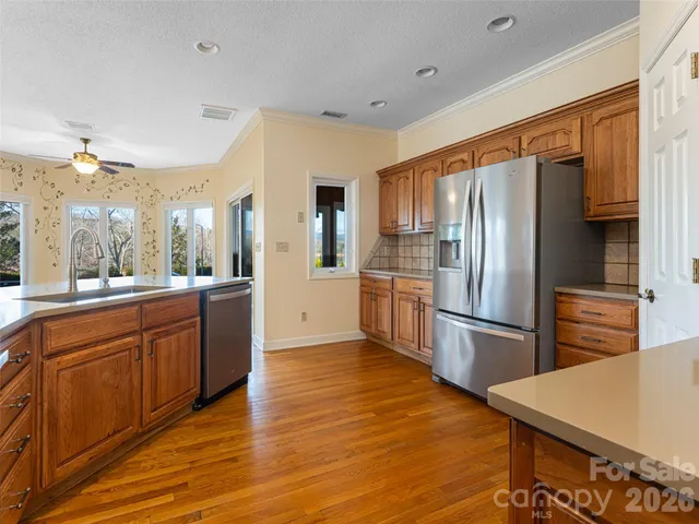 a white bath tub sitting in a bathroom next to a window