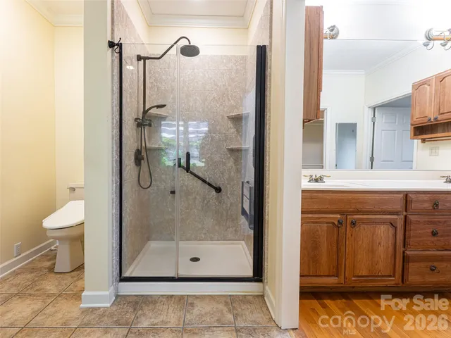 a view of a livingroom with workspace and a large window