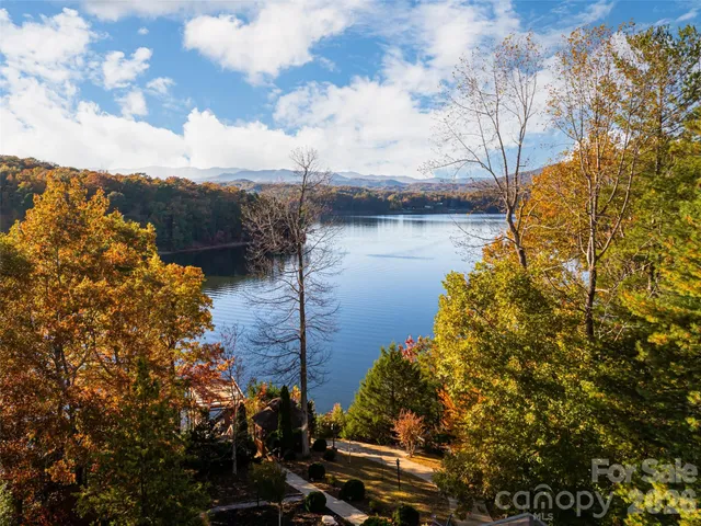 a view of a room with wooden floor and windows