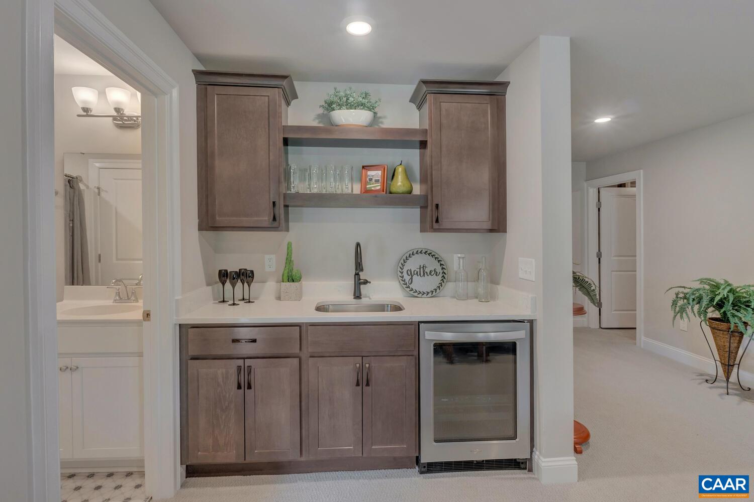 115 Riparian Court, Unit B Charlottesville, VA 22911 - Photo 34 of 58 a kitchen with cabinets and window