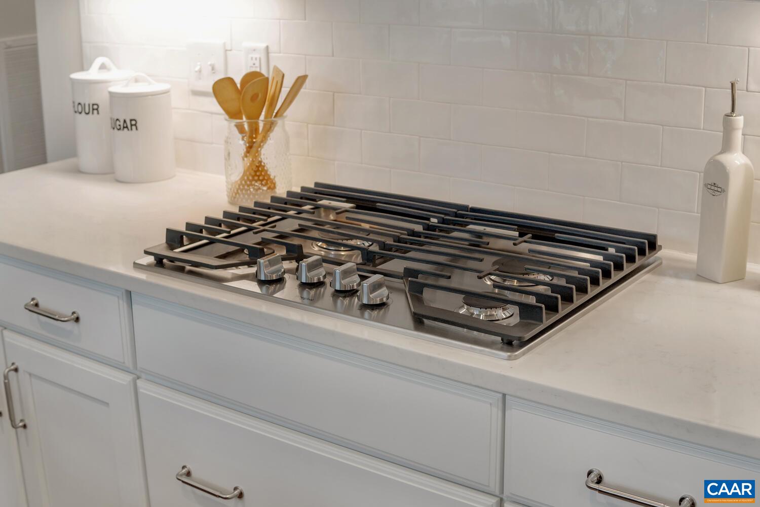 115 Riparian Court, Unit B Charlottesville, VA 22911 - Photo 43 of 58 a close view of a stove top oven sitting inside of a kitchen