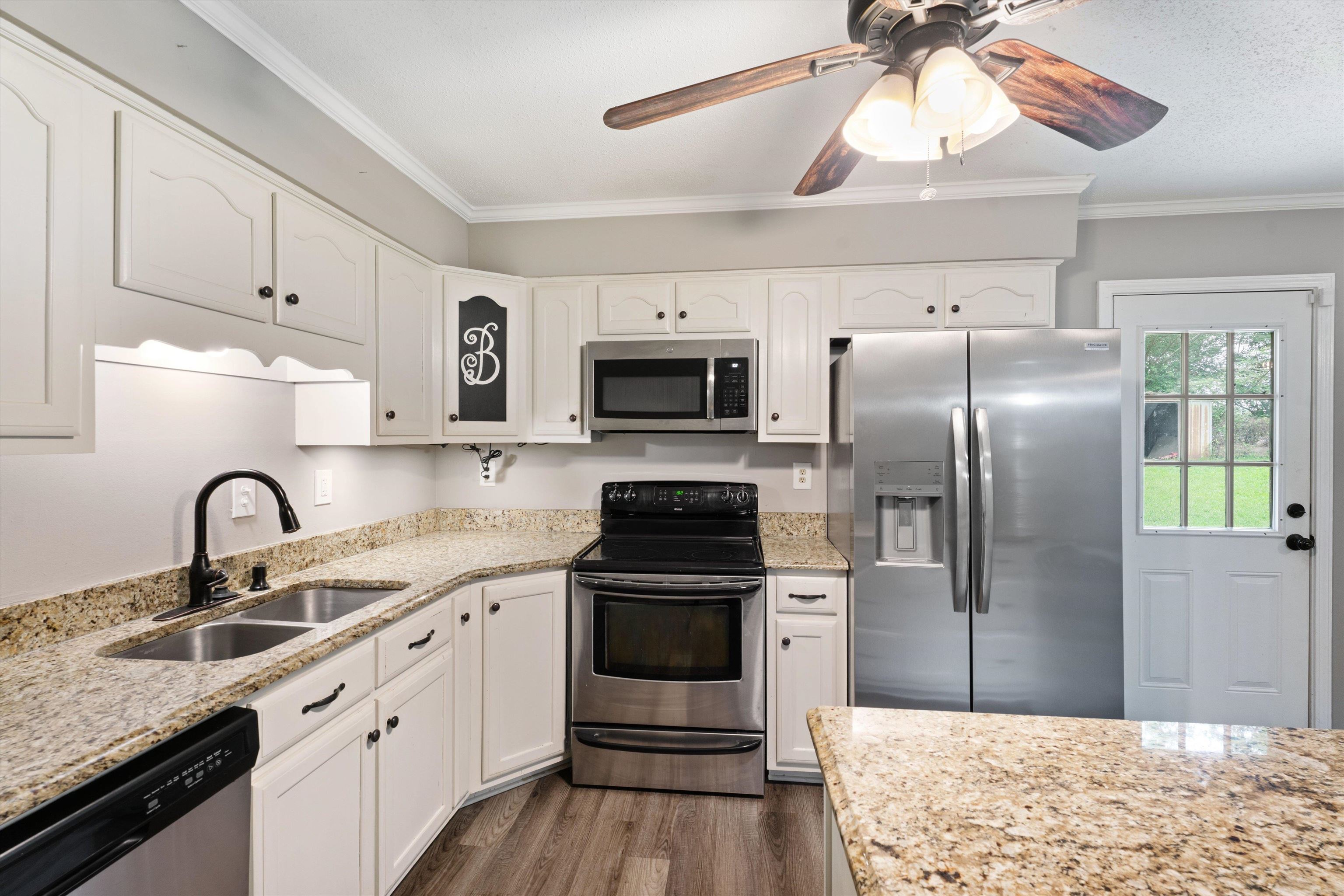 960 Greenview Road Collierville, TN 38017 - Photo 11 of 23 a kitchen with a sink stainless steel appliances and cabinets