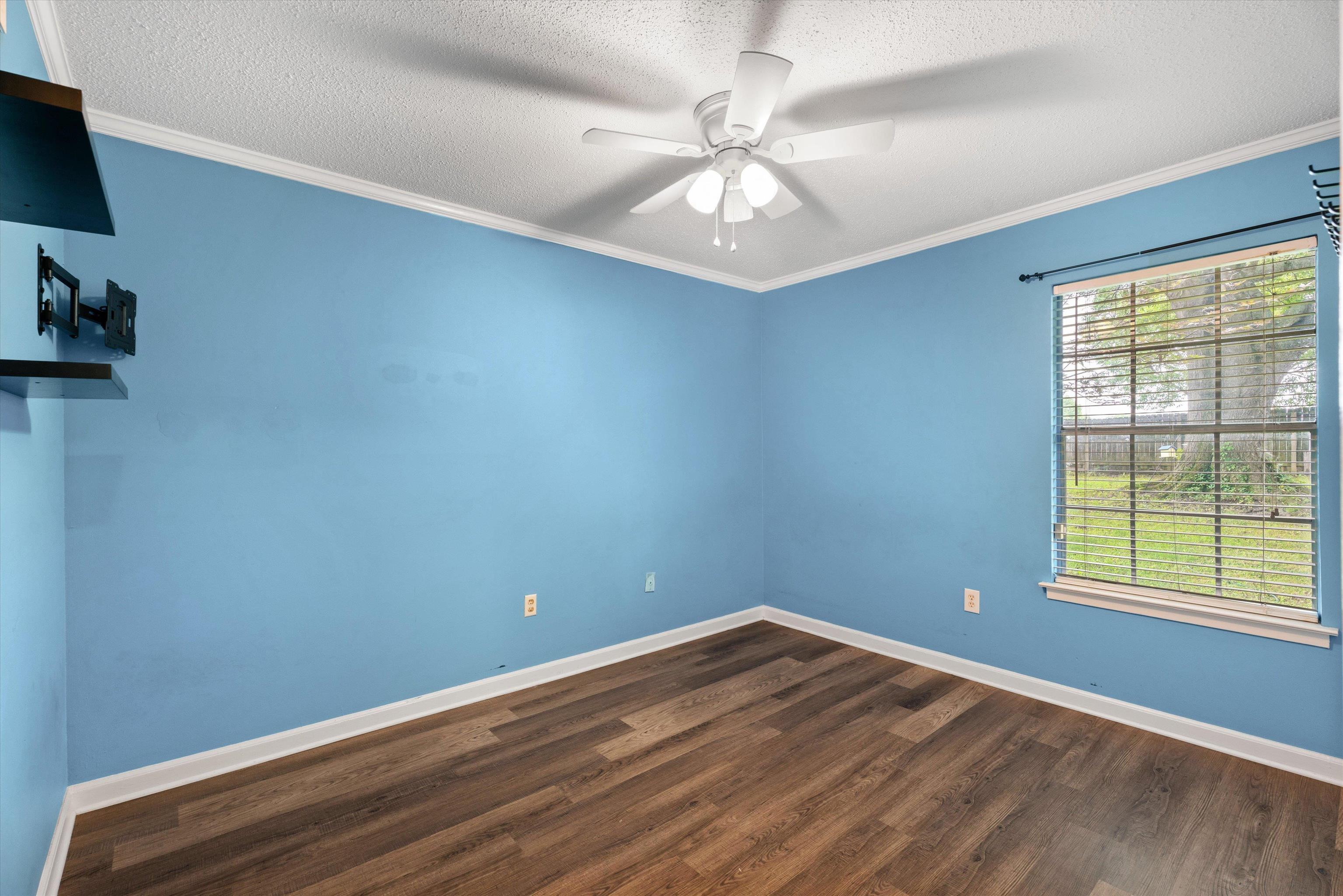 960 Greenview Road Collierville, TN 38017 - Photo 16 of 23 wooden floor in an empty room with a window