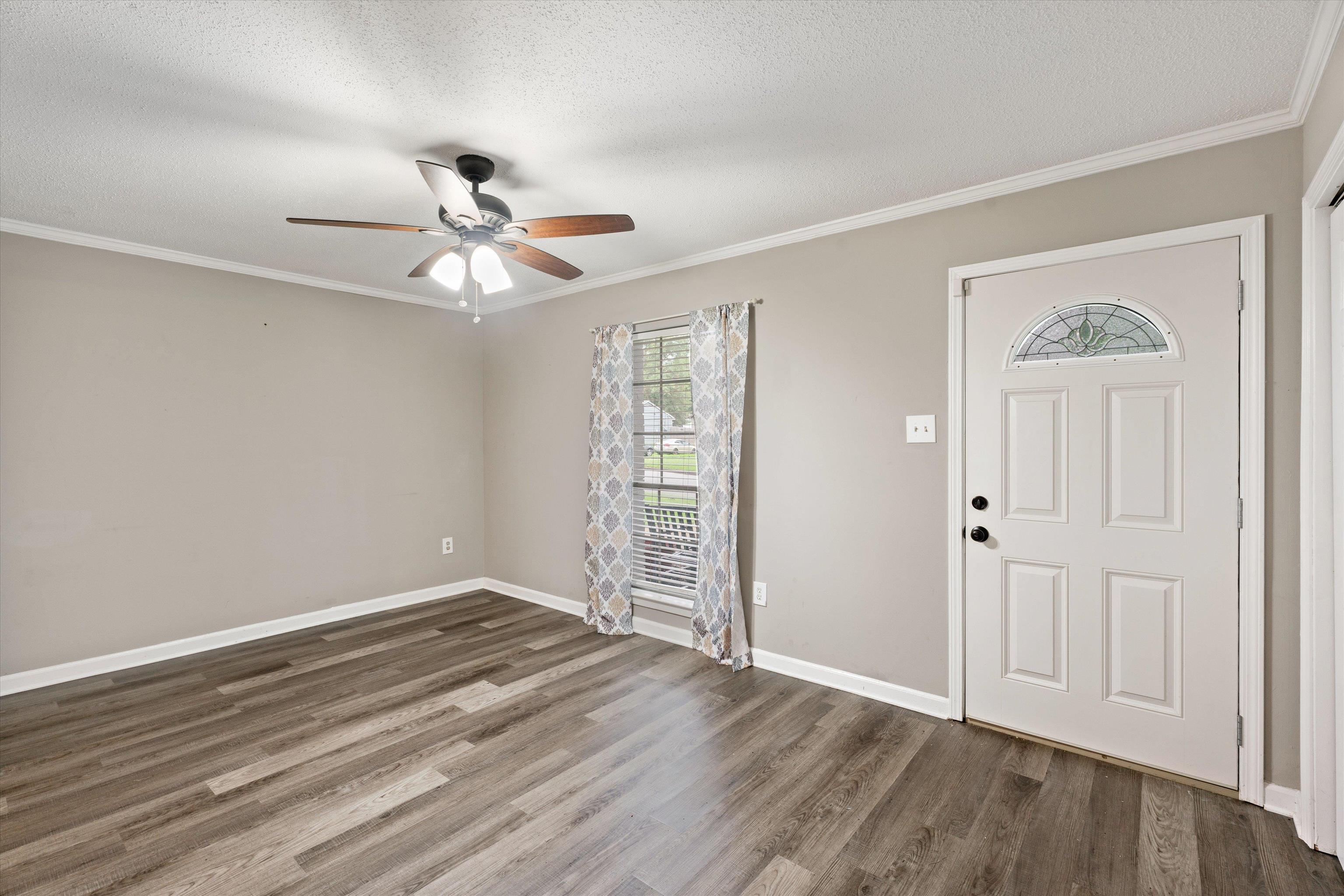 960 Greenview Road Collierville, TN 38017 - Photo 4 of 23 wooden floor in an empty room with a window