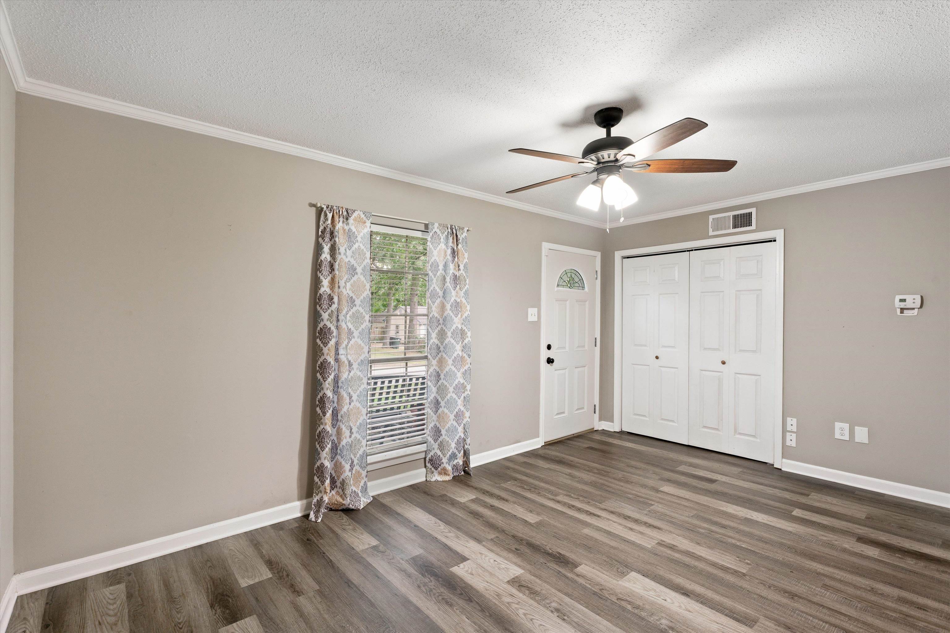 960 Greenview Road Collierville, TN 38017 - Photo 6 of 23 wooden floor in an empty room with a window