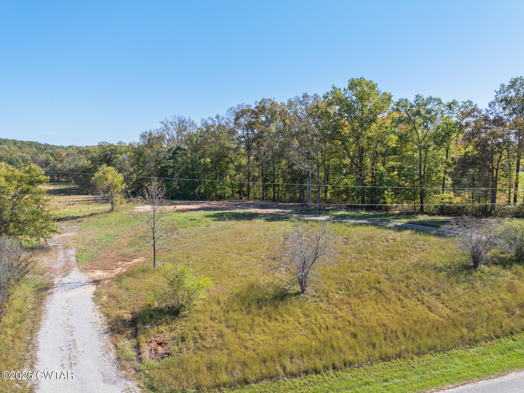 490 Maxwell Road Scotts Hill, TN 38374 - Photo 2 of 10 a view of a swimming pool