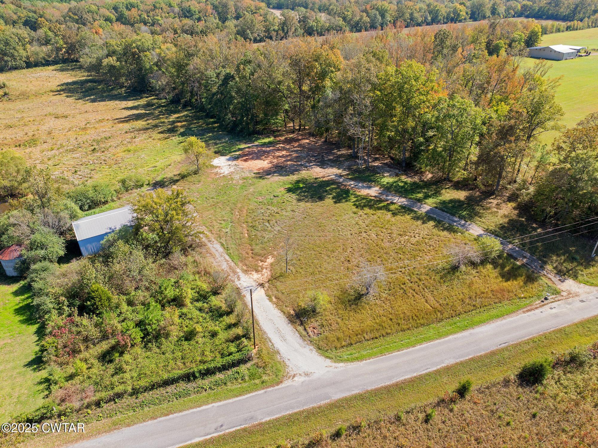 490 Maxwell Road Scotts Hill, TN 38374 - Photo 9 of 10 a view of swimming pool from a lake