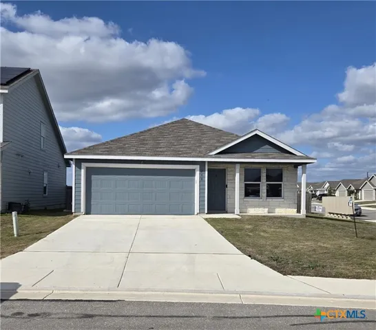 a front view of a house with yard