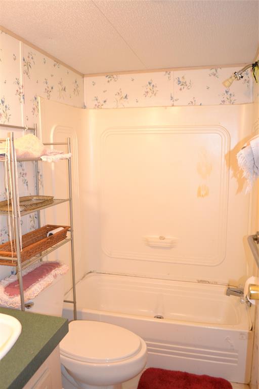 174 Kickapoo Quitman, TX 75783 - Photo 17 of 25 a bathroom with a toilet and a shower