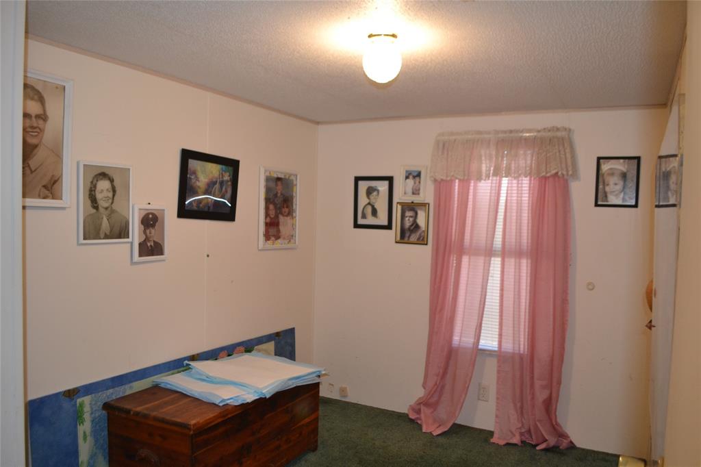 174 Kickapoo Quitman, TX 75783 - Photo 18 of 25 a room with window and furniture