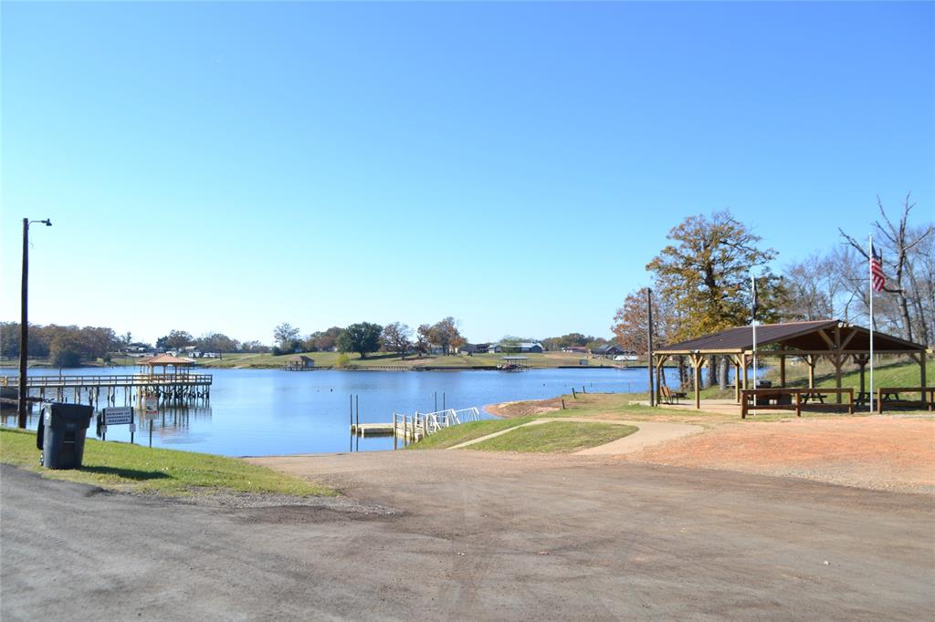 174 Kickapoo Quitman, TX 75783 - Photo 25 of 25 a view of swimming pool with outdoor seating and yard in the back