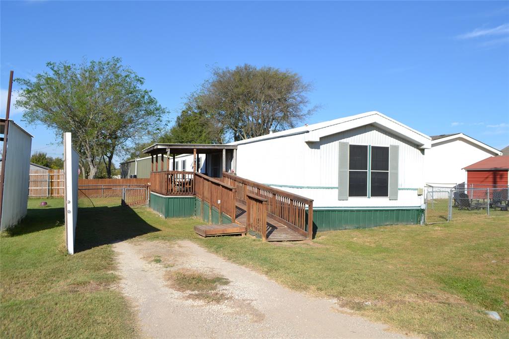 174 Kickapoo Quitman, TX 75783 - Photo 7 of 25 a view of a house with a yard