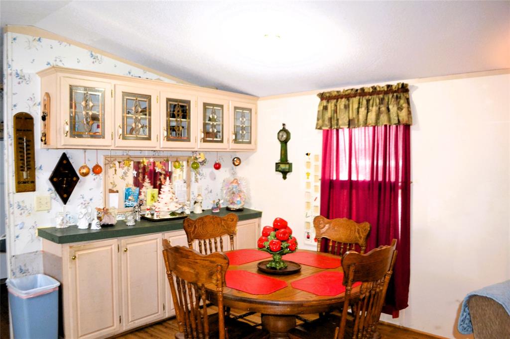 174 Kickapoo Quitman, TX 75783 - Photo 10 of 25 a view of a dining room with furniture and window