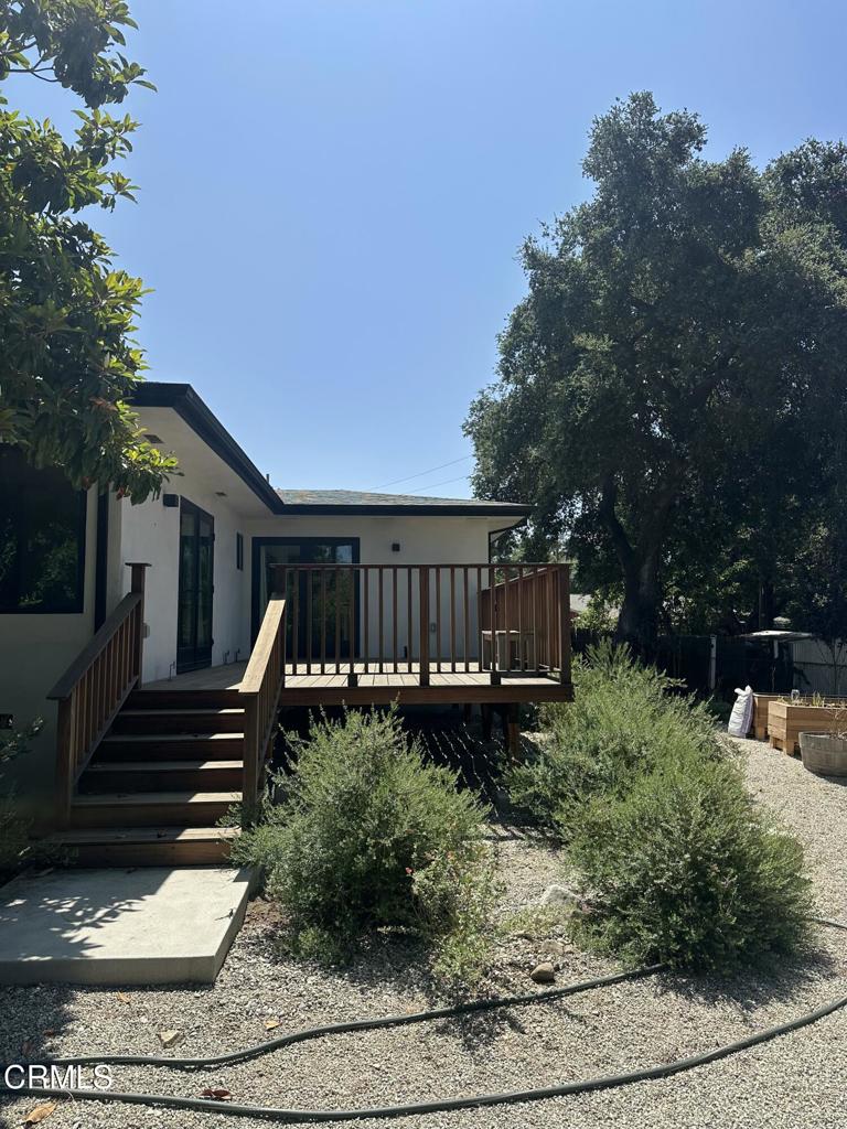 4119 Aralia Road Altadena, CA 91001 - Photo 9 of 10 a backyard of a house with wooden floor and outdoor seating
