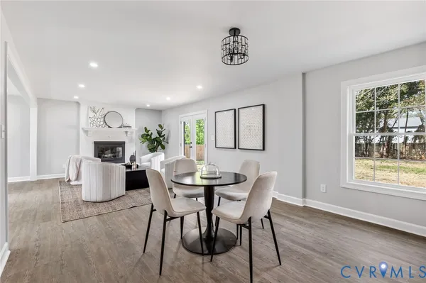 a dining room with furniture and window