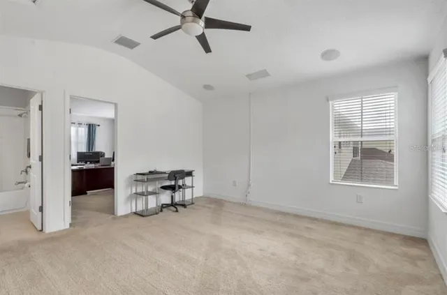 a view of a livingroom with furniture and a window