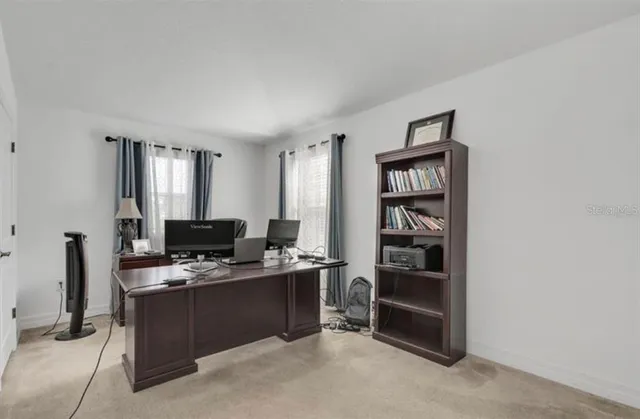 a view of a workspace with furniture