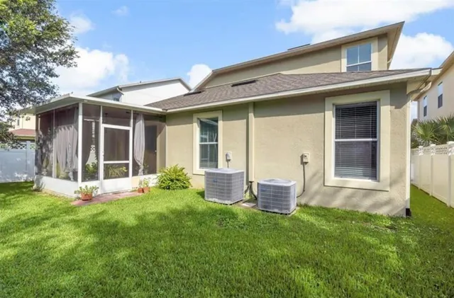 a front view of a house with a yard and porch