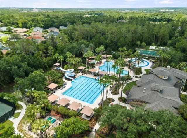 an aerial view of a house with a yard