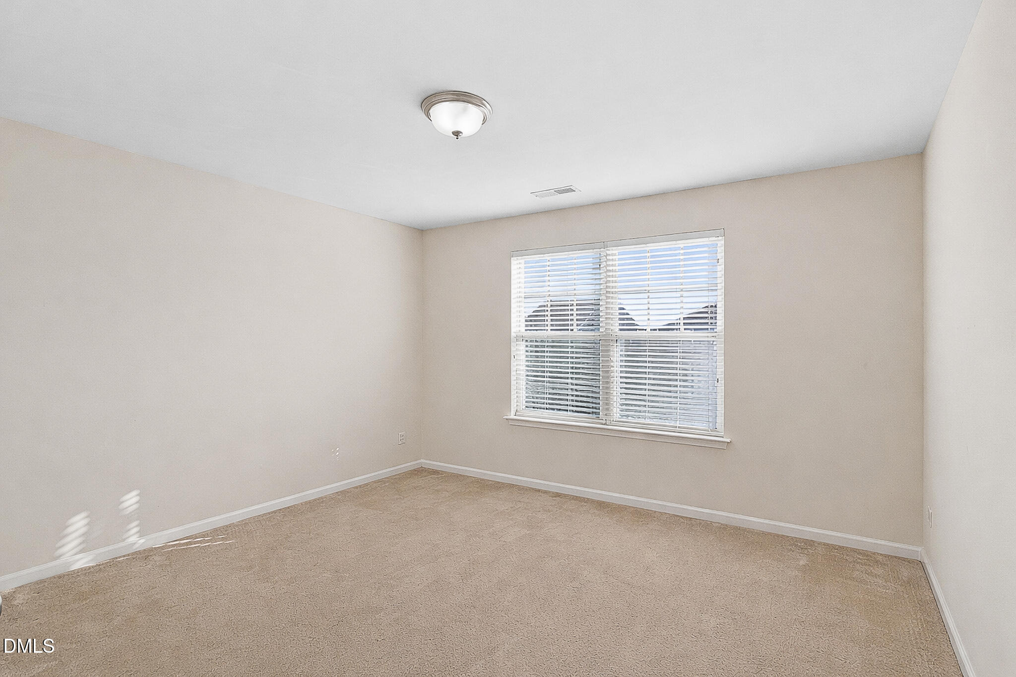 4249 Saubranch Hill Street Raleigh, NC 27616 - Photo 16 of 31 an empty room with a window