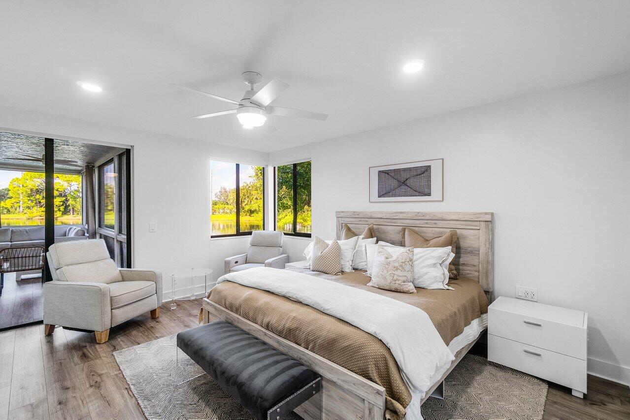 19173 Sabal Lake Drive, Unit 5155 Boca Raton, FL 33434 - Photo 16 of 33 a bedroom with a bed and a couch