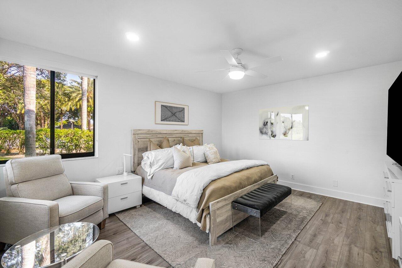 19173 Sabal Lake Drive, Unit 5155 Boca Raton, FL 33434 - Photo 17 of 33 a bedroom with a bed and a couch