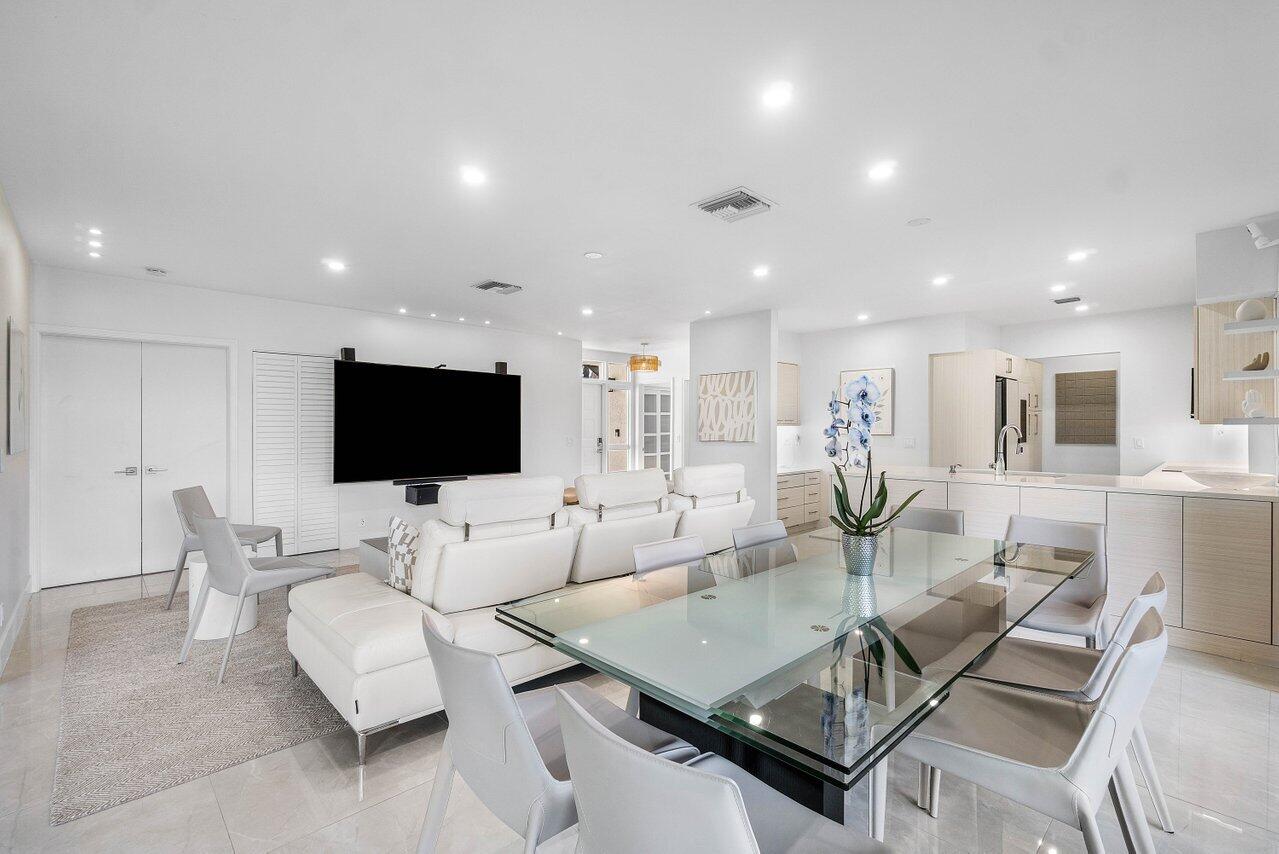 19173 Sabal Lake Drive, Unit 5155 Boca Raton, FL 33434 - Photo 6 of 33 a living room with furniture and a flat screen tv