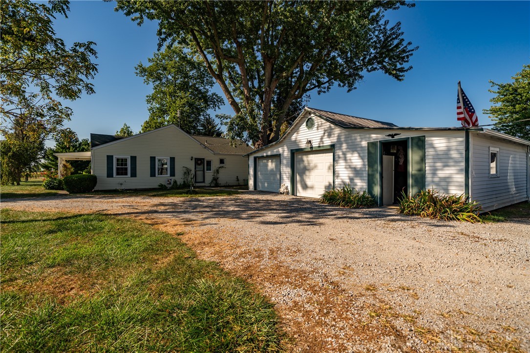 1599 Garringer Road Jamestown, OH 45335 - Photo 57 of 73 This charming home features a separate garage and ample outdoor space, perfect for tranquil living.