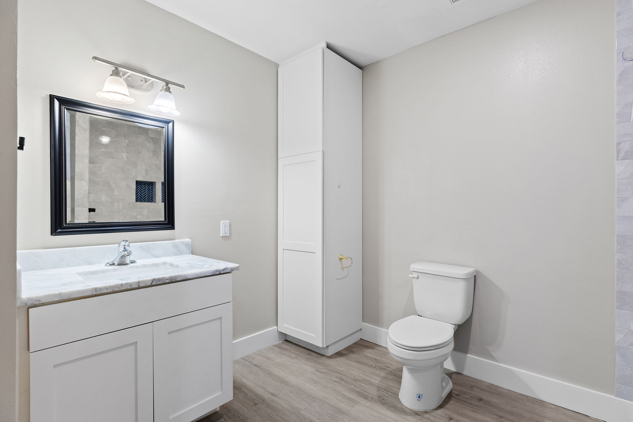 813 Central Avenue Elgin, TX 78621 - Photo 12 of 22 Bathroom with vanity and light wood-style floors