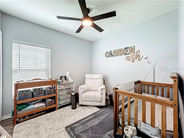 a bedroom with furniture and a window