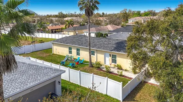 an aerial view of a house with a garden