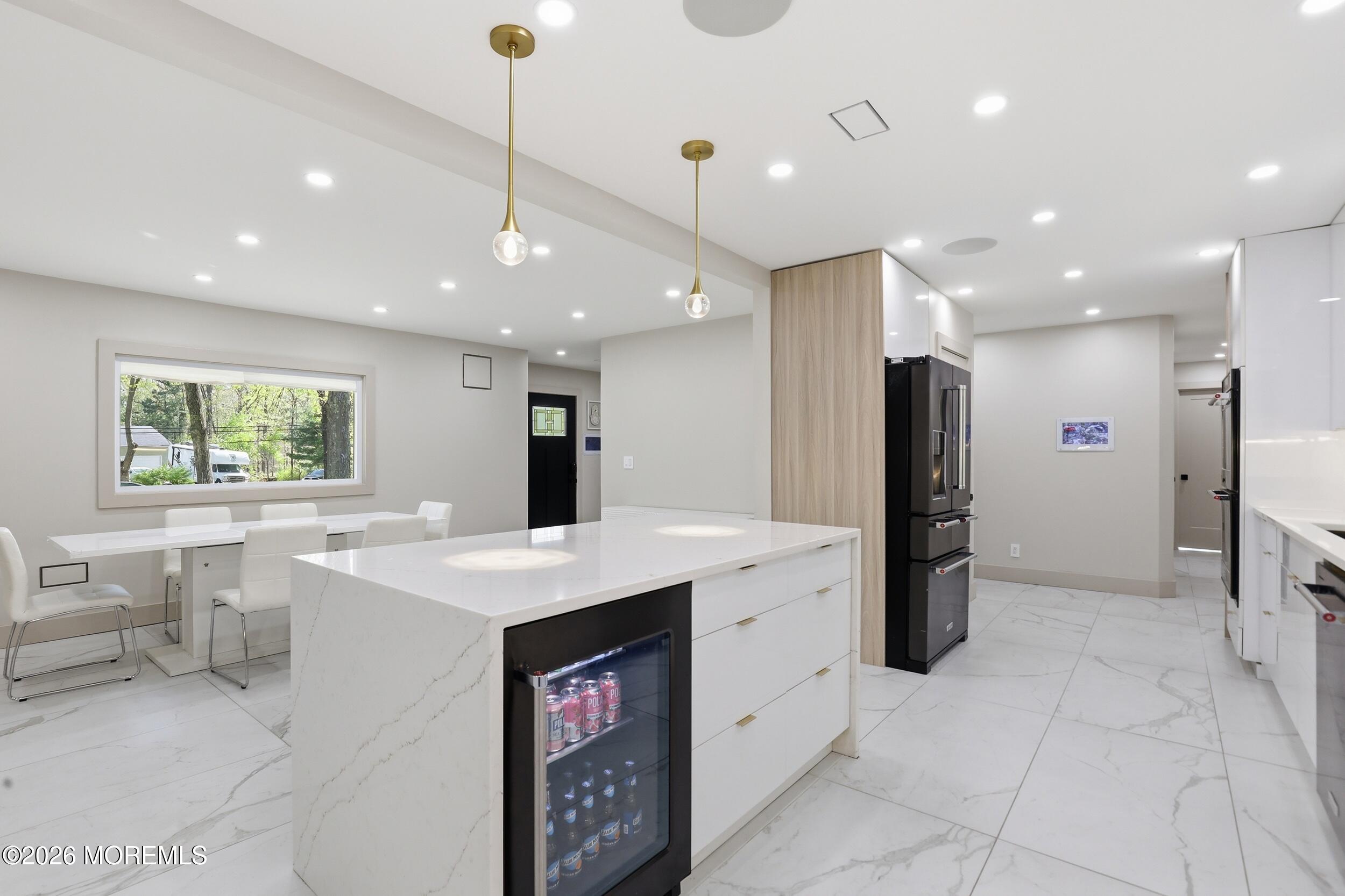 492 Cobain Road Jackson, NJ 08527 - Photo 14 of 47 a kitchen with stainless steel appliances kitchen island sink refrigerator and dining table