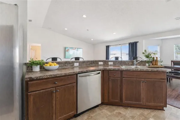 a kitchen with sink and cabinets