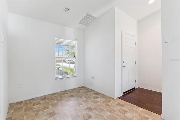 a view of an empty room and window