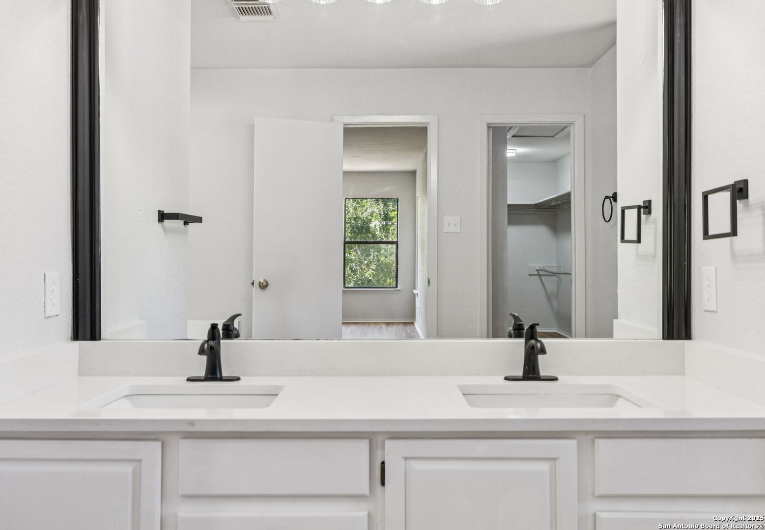 8127 Talkenhorn Converse, TX 78109 - Photo 11 of 57 a bathroom with a sink and a mirror