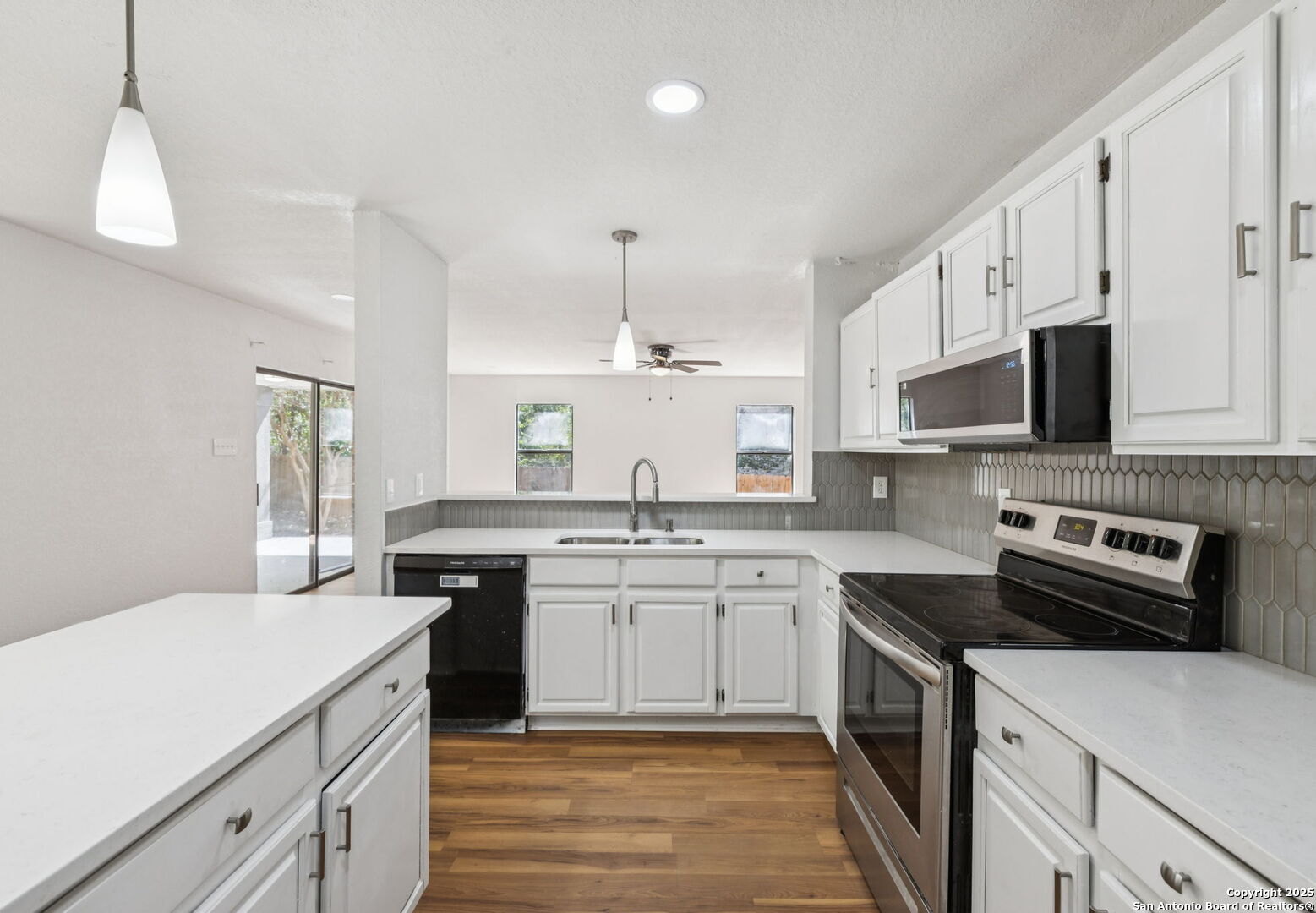 8127 Talkenhorn Converse, TX 78109 - Photo 14 of 57 a kitchen with a sink stove and microwave