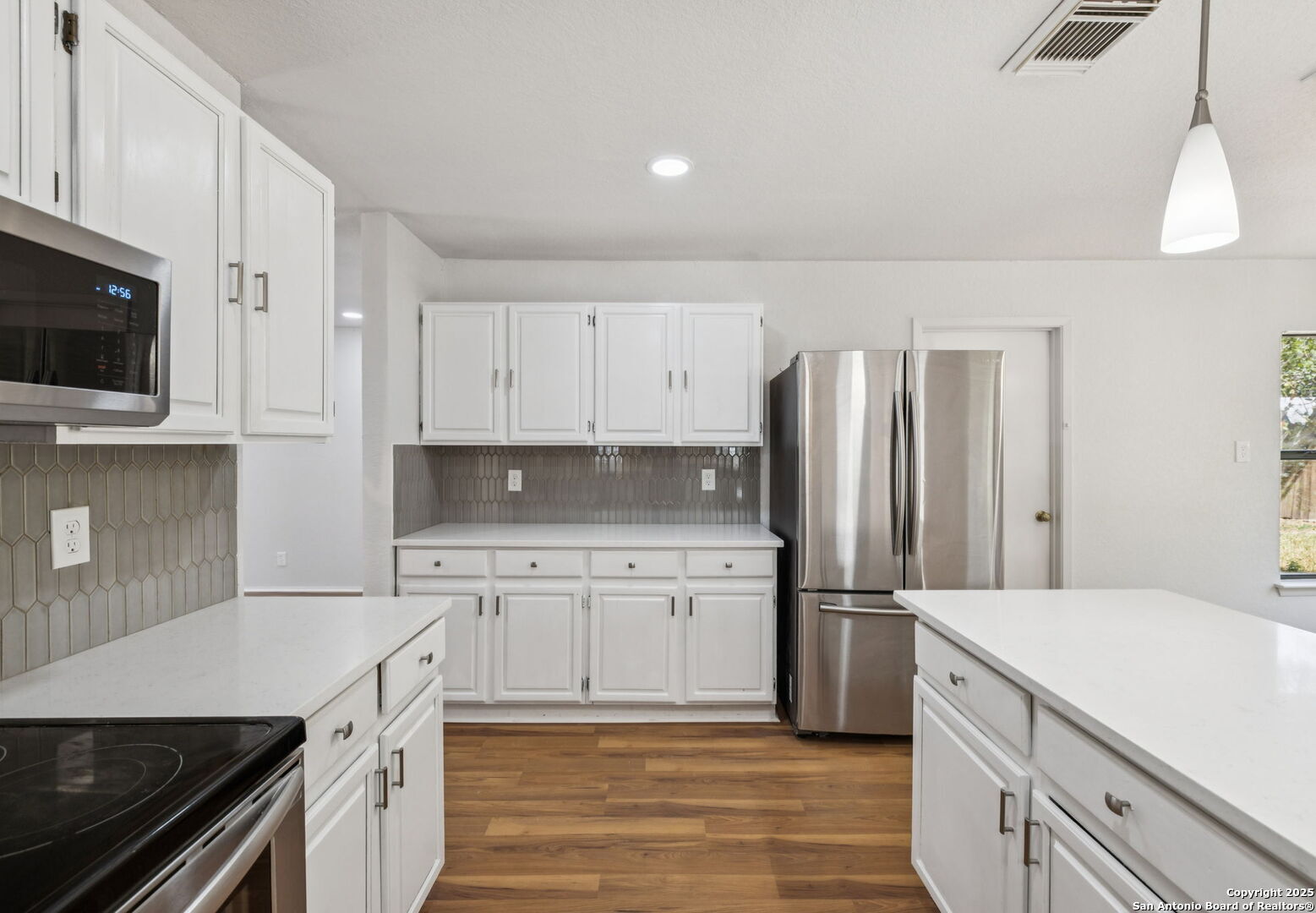 8127 Talkenhorn Converse, TX 78109 - Photo 15 of 57 a kitchen with a sink stove and refrigerator