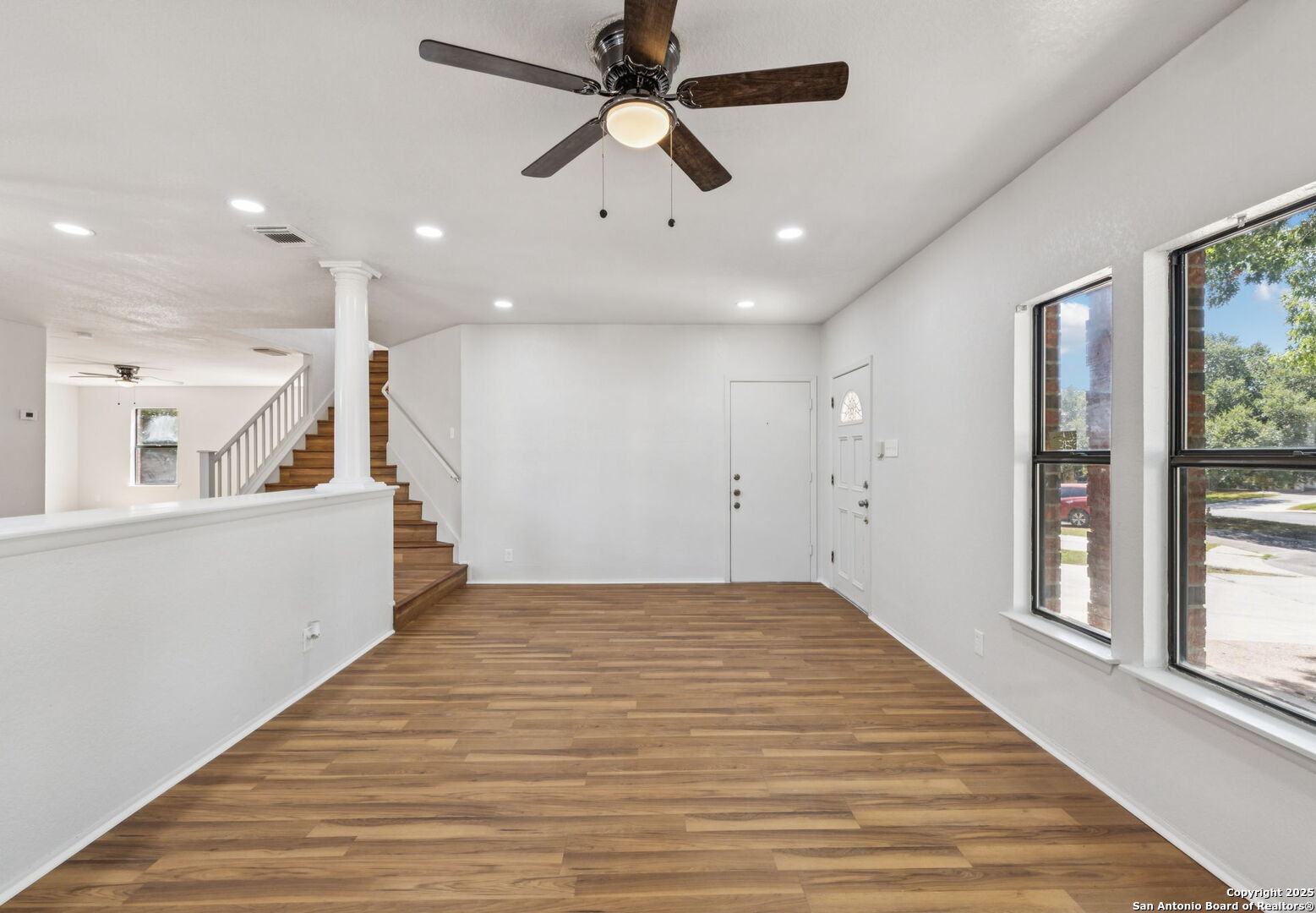 8127 Talkenhorn Converse, TX 78109 - Photo 27 of 57 a view of an empty room with window and wooden floor