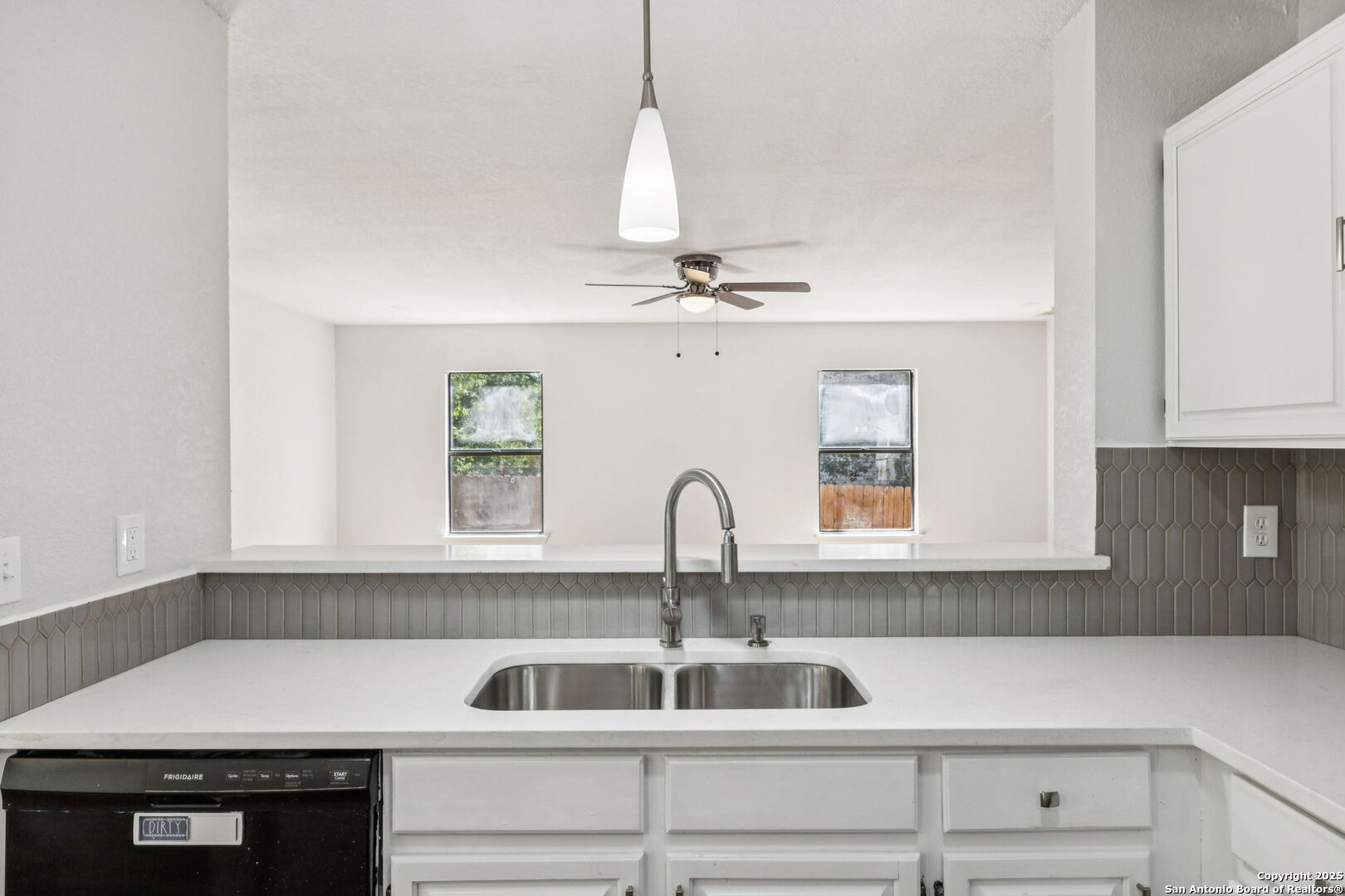 8127 Talkenhorn Converse, TX 78109 - Photo 33 of 57 a kitchen with a sink and cabinets