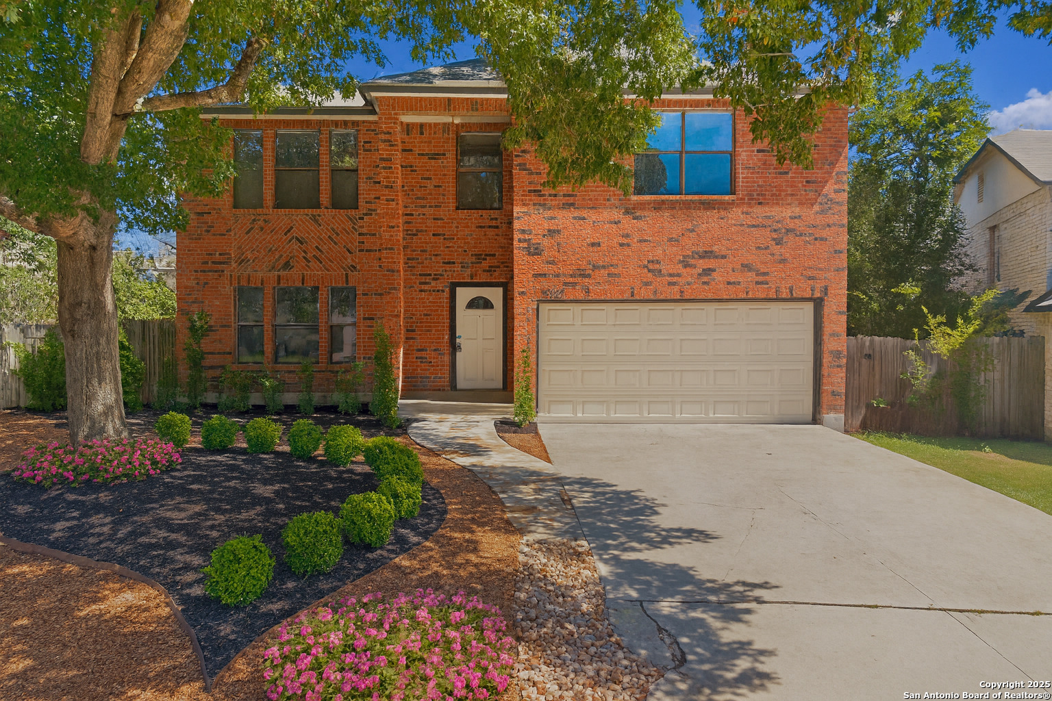 8127 Talkenhorn Converse, TX 78109 - Photo 34 of 57 a front view of a house with a yard and garage