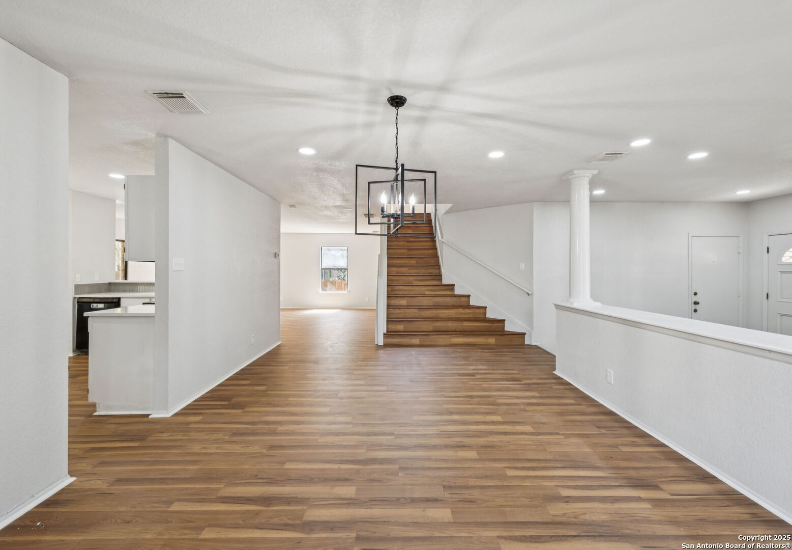 8127 Talkenhorn Converse, TX 78109 - Photo 4 of 57 a view of a hallway with wooden floor and staircase