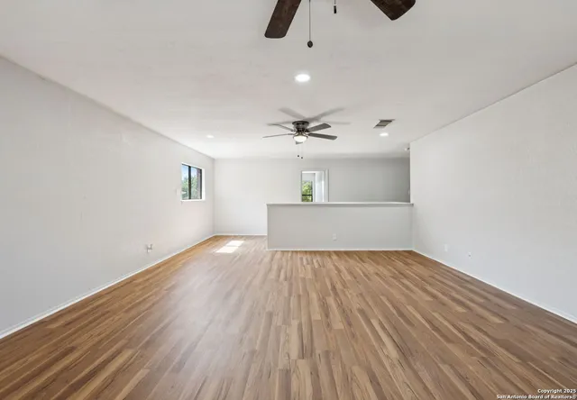 a bathroom with a double vanity sink a mirror and a bathtub