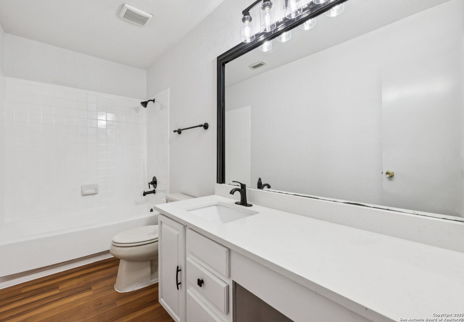 8127 Talkenhorn Converse, TX 78109 - Photo 46 of 57 a bathroom with a sink a toilet and a large mirror