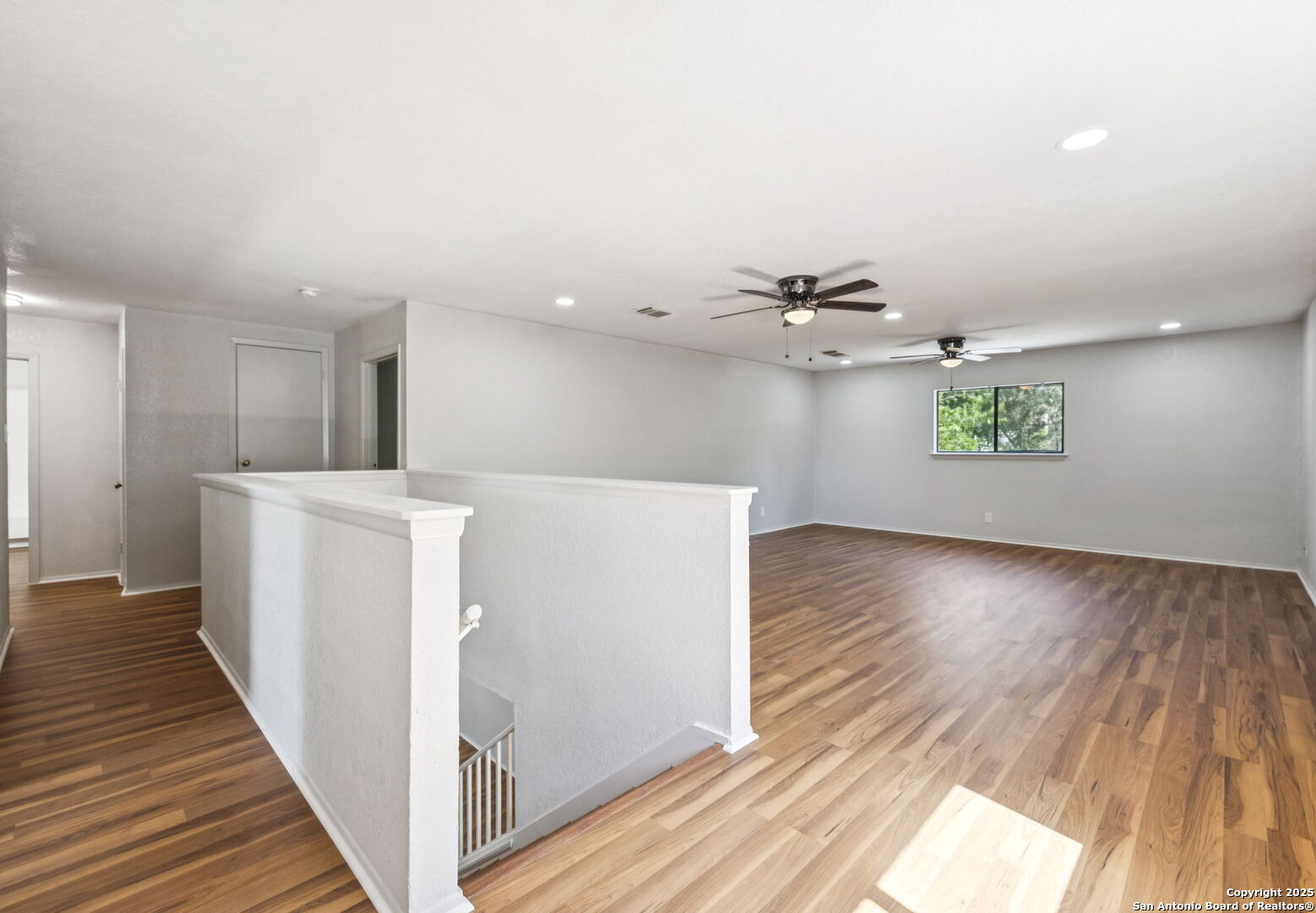 8127 Talkenhorn Converse, TX 78109 - Photo 51 of 57 a view of a hallway with wooden floor and staircase